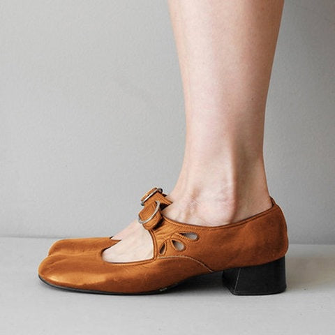 Brown Mary Jane shoe with a buckle strap, petal cut outs and a low block heel, side view, size 42 option