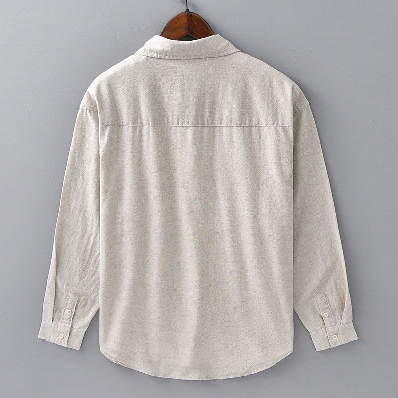 Back view of the mens cotton linen blend shirt showing the shoulder yoke and curved hem