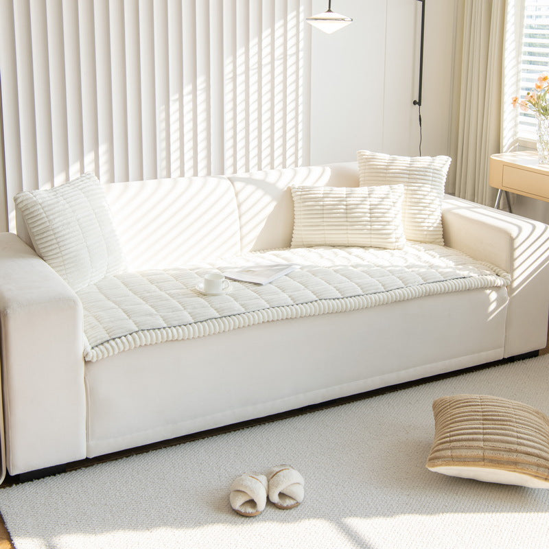 Sweet Serene White quilted plush sofa cover on a sofa, 90 x 120 cm