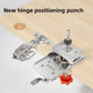 Stainless steel hinge positioning punch on a light wood board beside a concealed cabinet hinge and drill bit