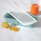 Flexible platinum silicone ice cube tray in a large cube layout for chilled drinks