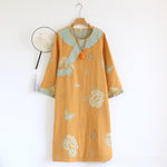 Detail of the round neckline and washed contrast shoulder yoke on the nightgown