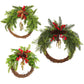 Three Christmas wreaths of different sizes with rattan rings, evergreen sprigs, pine cones, red berries and bells