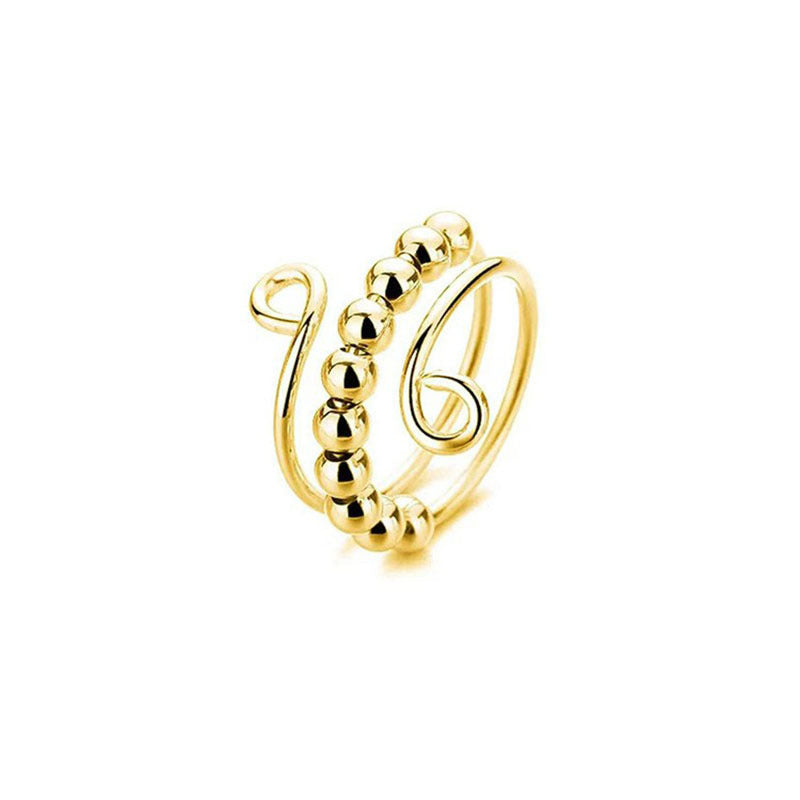 Silver tone spinner bead ring with small round beads that roll along the coiled open band