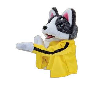 Grey and white husky plush hand puppet in a yellow martial arts outfit, side view on white