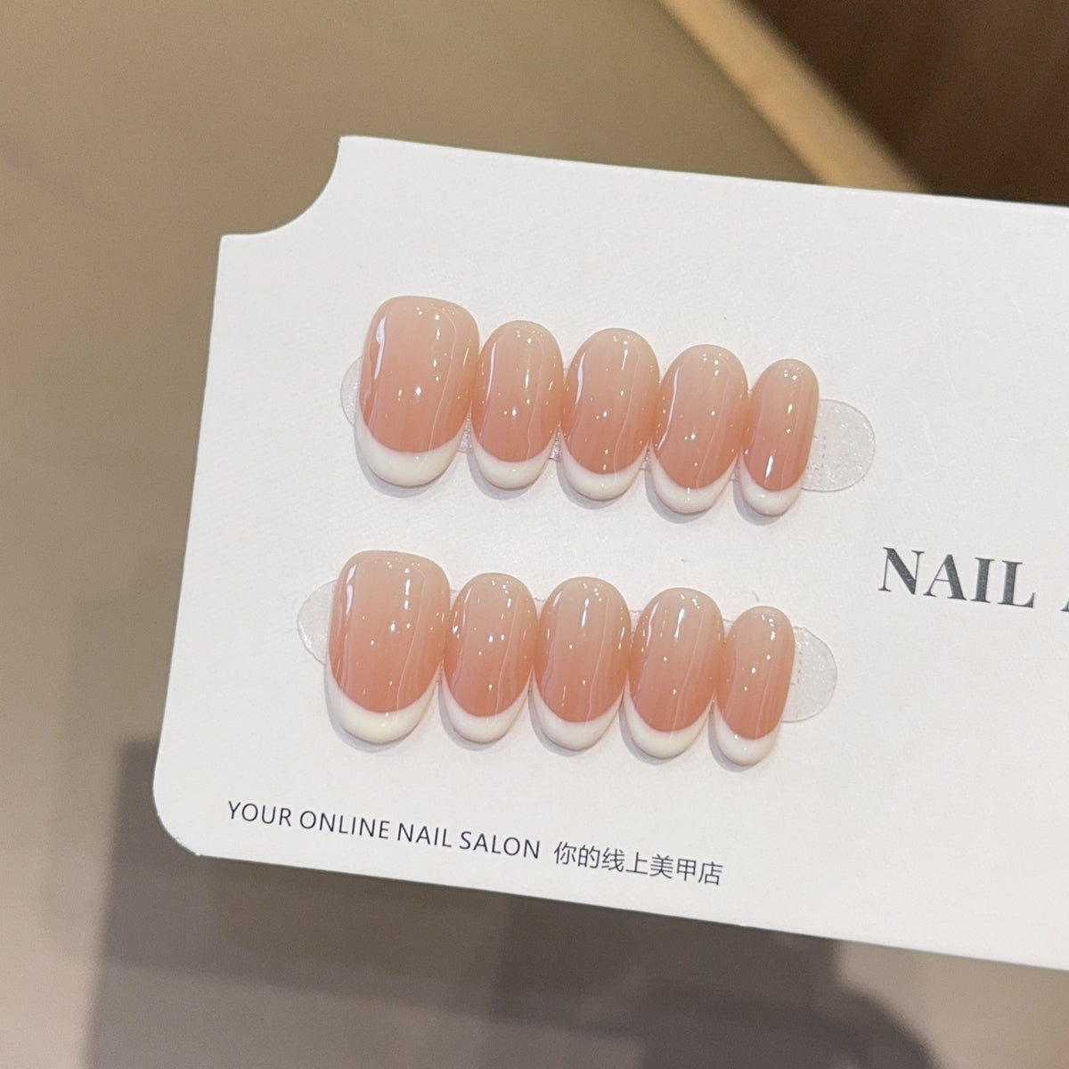 Side angle of the tapered press-on nail showing its curved shape