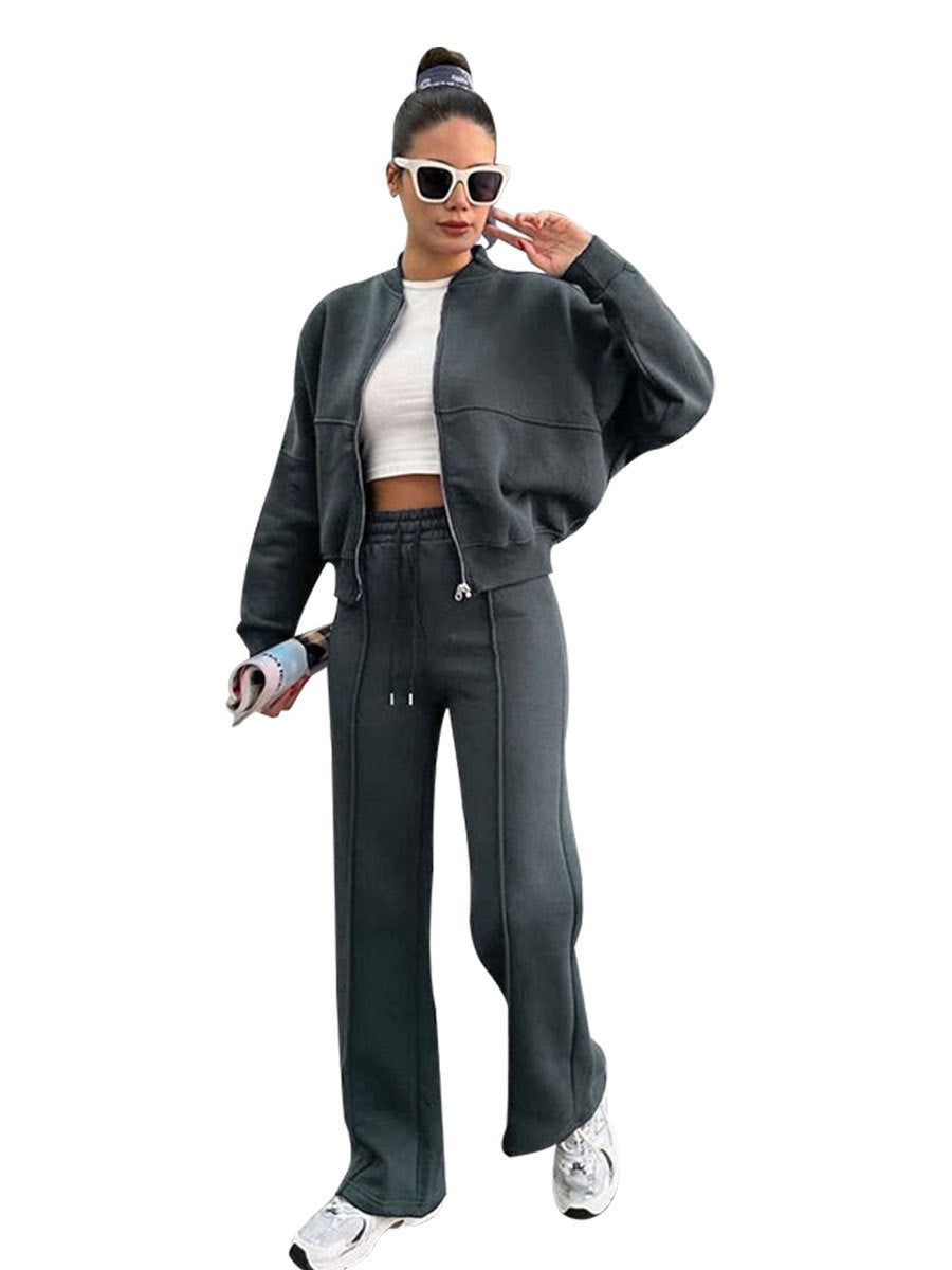 Womens fleece zip jacket and wide-leg pants set worn by a model, back view