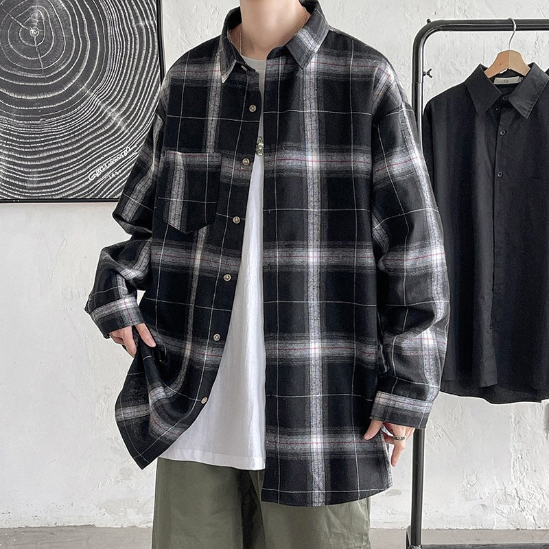 Black plaid oversized long sleeve shirt worn open, front styling view