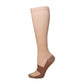 Flat lay of several mid calf sport socks in solid tones on a plain surface