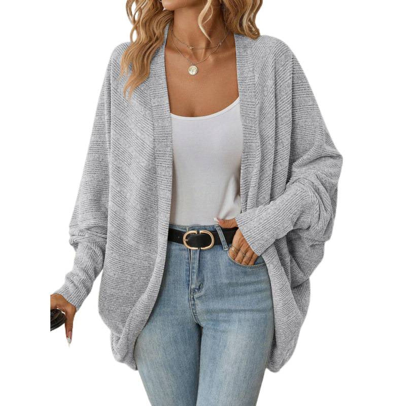 Side view of a blue womens open front drape cardigan with batwing sleeves