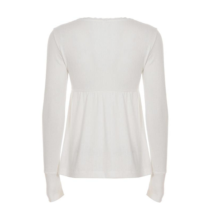 Back view of a white long sleeve babydoll top with a gathered waist seam and deep cuffs on a plain background