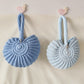 Handmade Woven Conch Shell Coin Purse | side profile angle shot