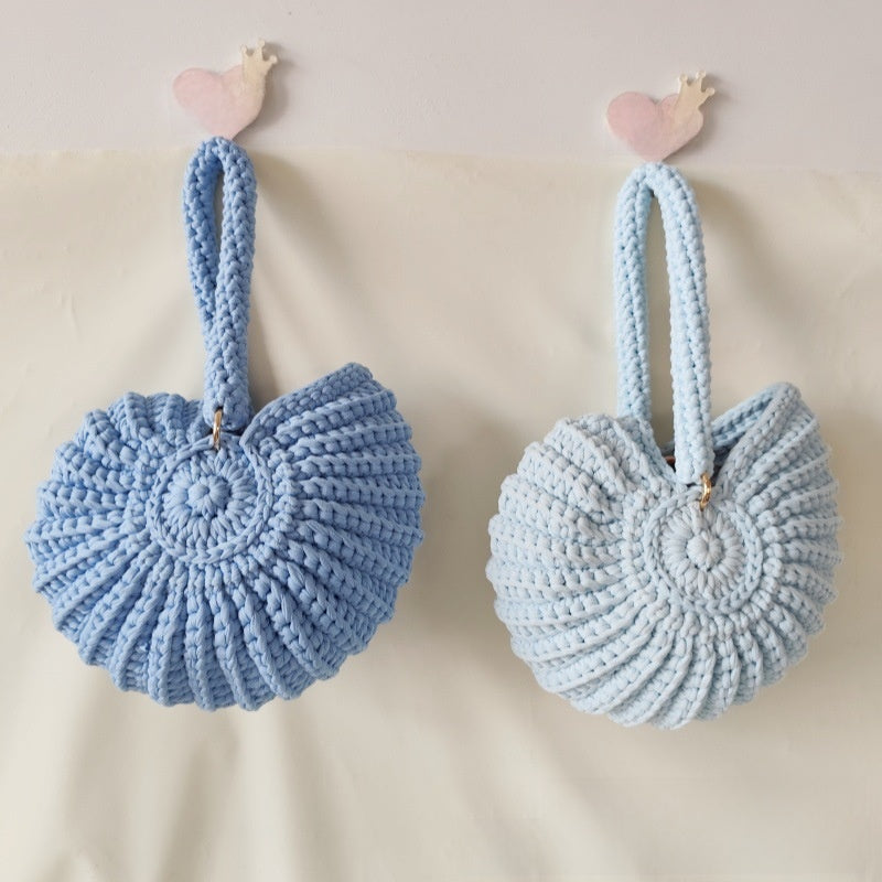 Handmade Woven Conch Shell Coin Purse | side profile angle shot