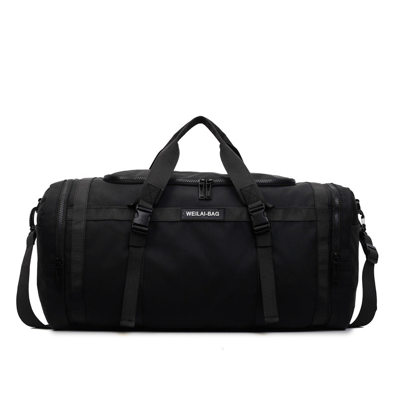Side view of the travel duffel bag showing a zip pocket for shoes or damp gear