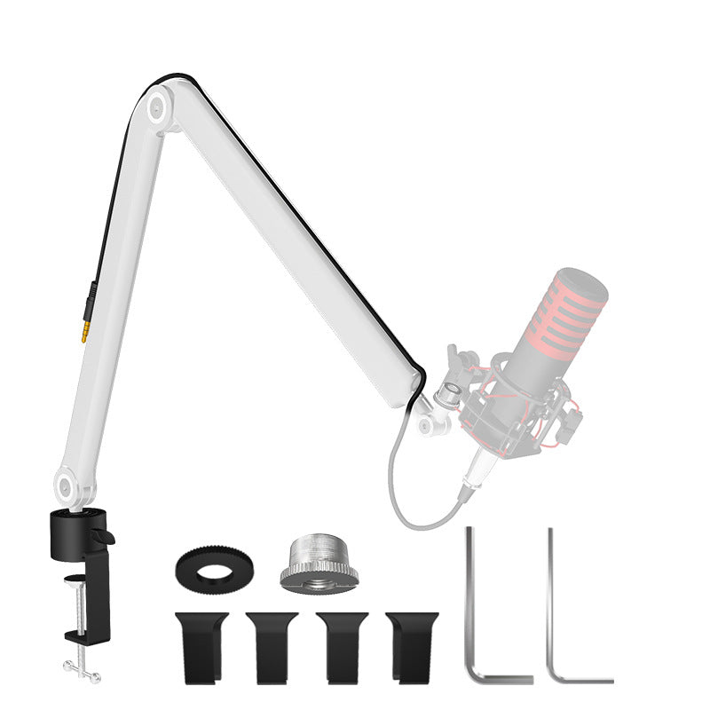 White aluminum microphone boom arm folded on its desk clamp beside the included accessory set