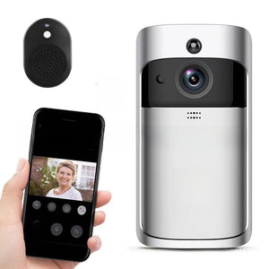 Full silver video doorbell beside its wireless chime and a phone showing a visitor