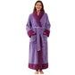 Woman wearing a long purple flannel bathrobe with a plum shawl collar, cuffs and hem, purple variant