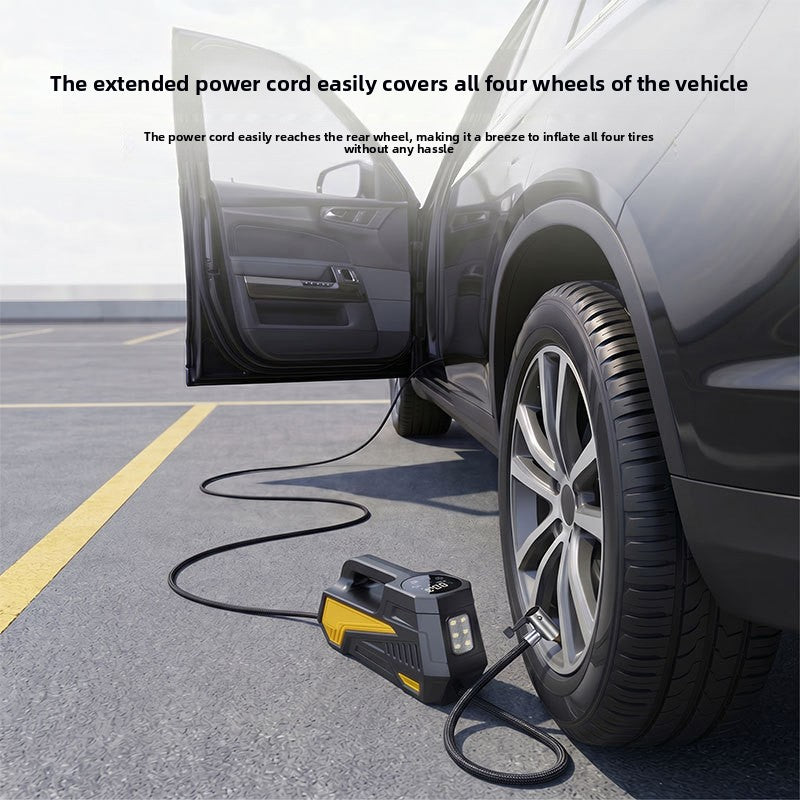 Car with an open door and a tire inflator on the ground, its power cord reaching a rear wheel