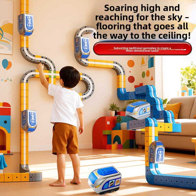 Child running the electric railcar on a magnetic track built up a wall with suction cup supports