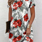 Digital floral print round neck dress with short sleeves shown front on a model