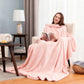 Woman reading in an armchair in a pink plain flannel sleeved blanket draped over her lap, Flannel pink option