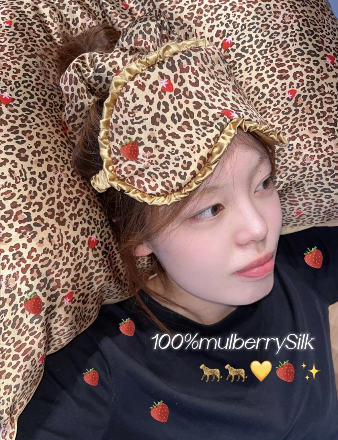 Woman resting on a coffee leopard silk pillowcase with a leopard sleep mask