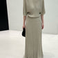 Greige long ribbed knit skirt with flat waistband styled with a knit top, top not included