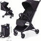 Black lightweight travel stroller open with canopy and folded compact beside it