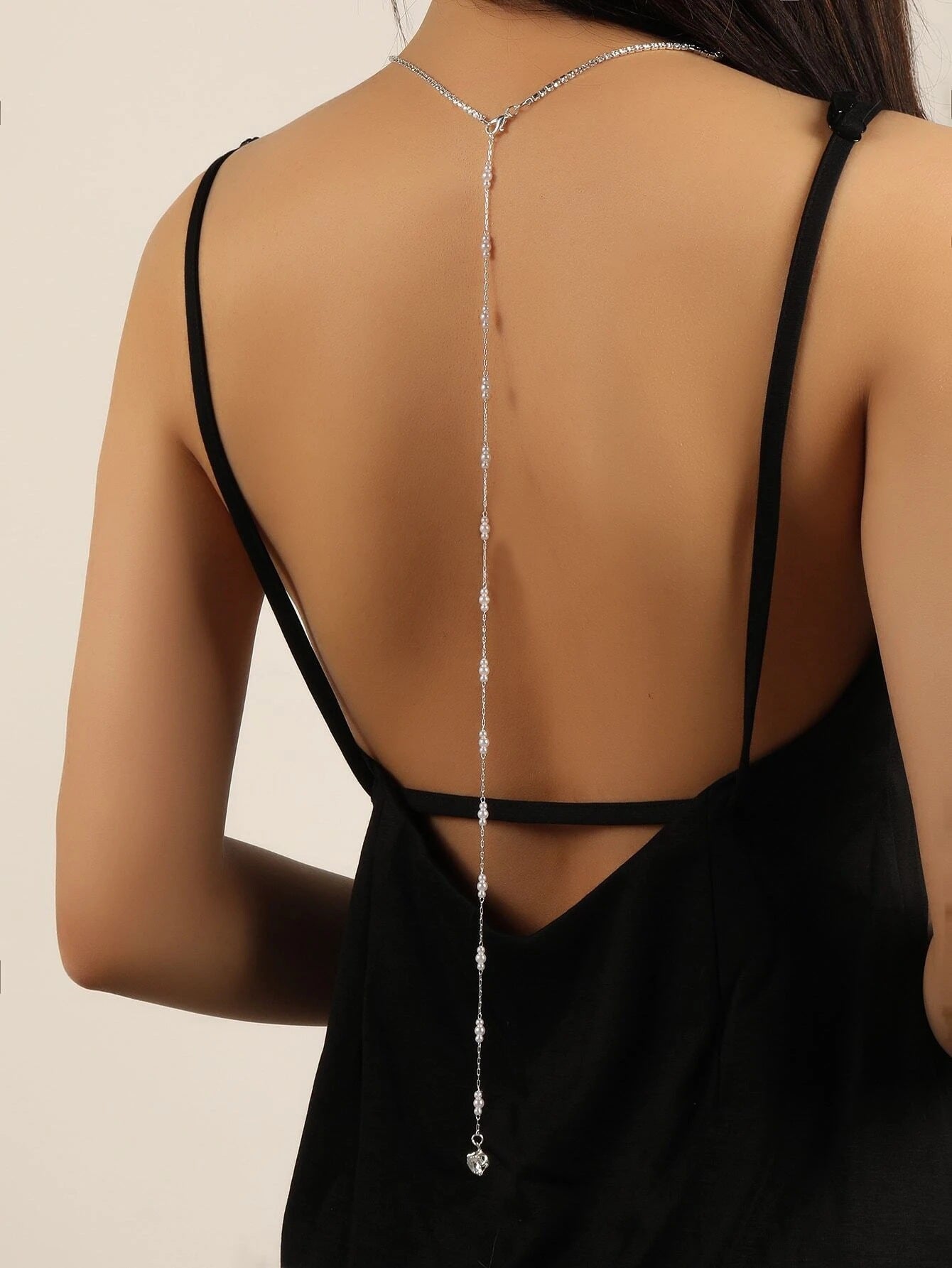 Silver back chain with pearl beads and a crystal drop down the spine