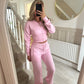 Womens two piece lounge set, a front zip jacket and straight leg drawstring pants in a soft sweat knit