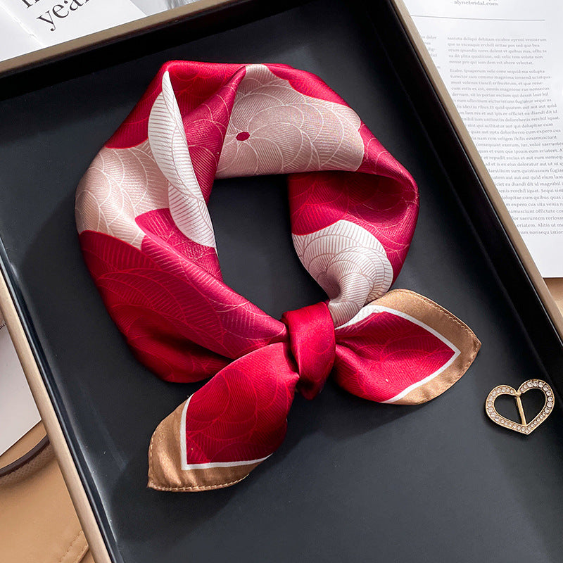 Red and white color block printed square scarf with a satin sheen and hemmed edges, shown displayed