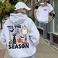 Light gray Halloween graphic hoodie from behind, with an inset of the chest print and kangaroo pocket at the front