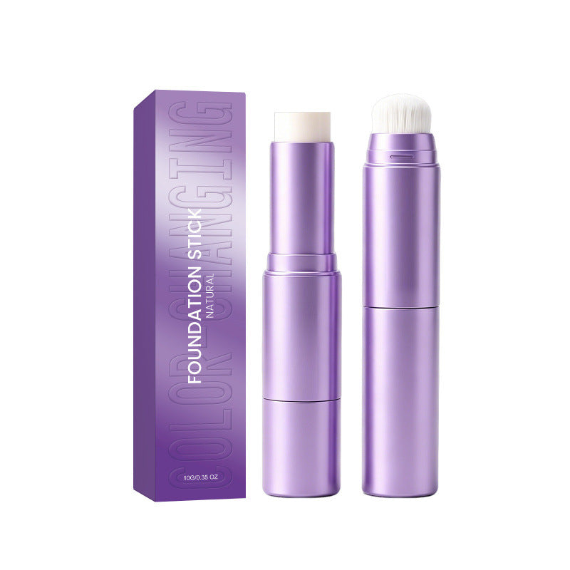 Purple Foundation Stick carton, the white cream stick and the round brush end of the purple metal case