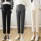 Maternity cropped trousers shown on three models with the high over the belly panel