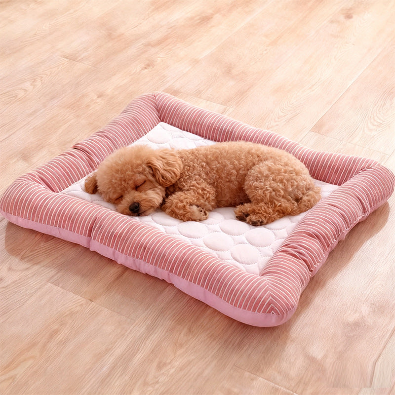 Sky blue ice silk pet cooling mat with a cat resting on it on the floor