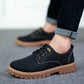Black low-top lace-up derby shoe with lugged rubber sole worn with rolled jeans, EU 43 option