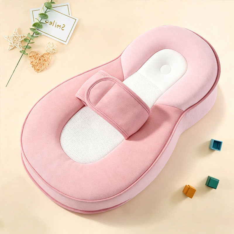 Option Pink: pink wedge lounger pillow with a white mesh insert and strap on a cream background with small blocks