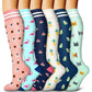 Assorted knee-high compression socks laid out to show the full pattern range