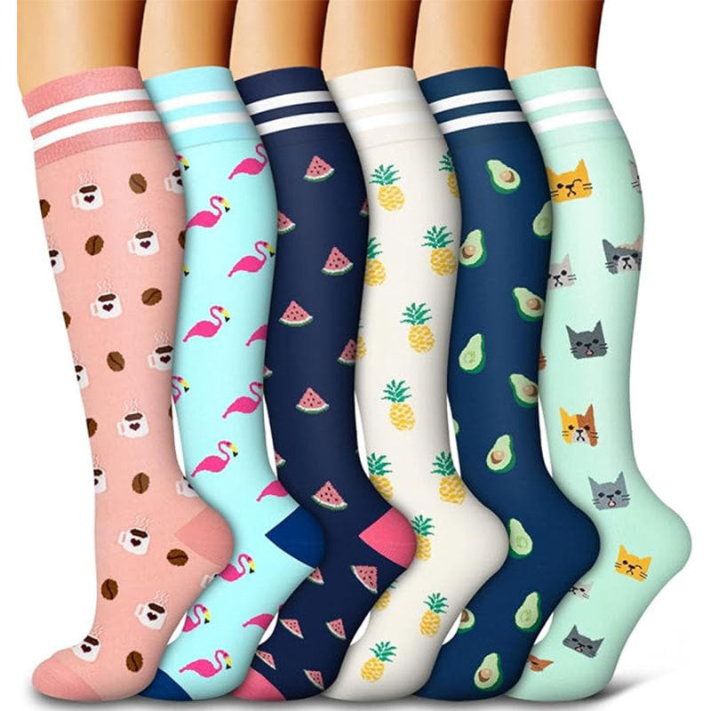 Assorted knee-high compression socks laid out to show the full pattern range