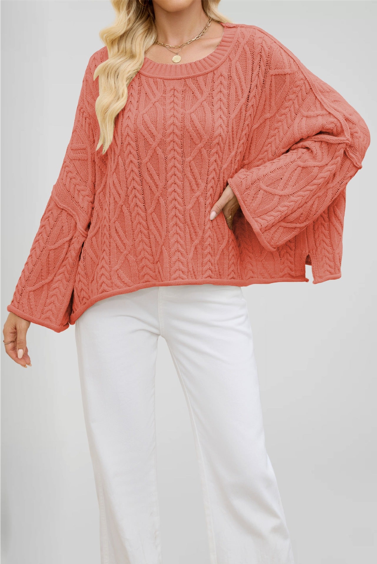Womens twist cable knit sweater with a rolled crew neck and dropped shoulder sleeves