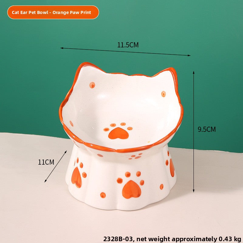 Orange rimmed cat ear ceramic raised bowl with orange paw prints, 11.5 by 11 cm and 9.5 cm high