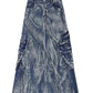 Flat lay of the marbled acid-wash denim maxi skirt with twin front zippers, cargo pockets and buckle straps
