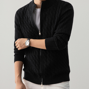 Close view of the stand collar and short neck zip of the cable knit sweater