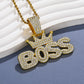 Crown pendant necklace in gold tone under soft studio light