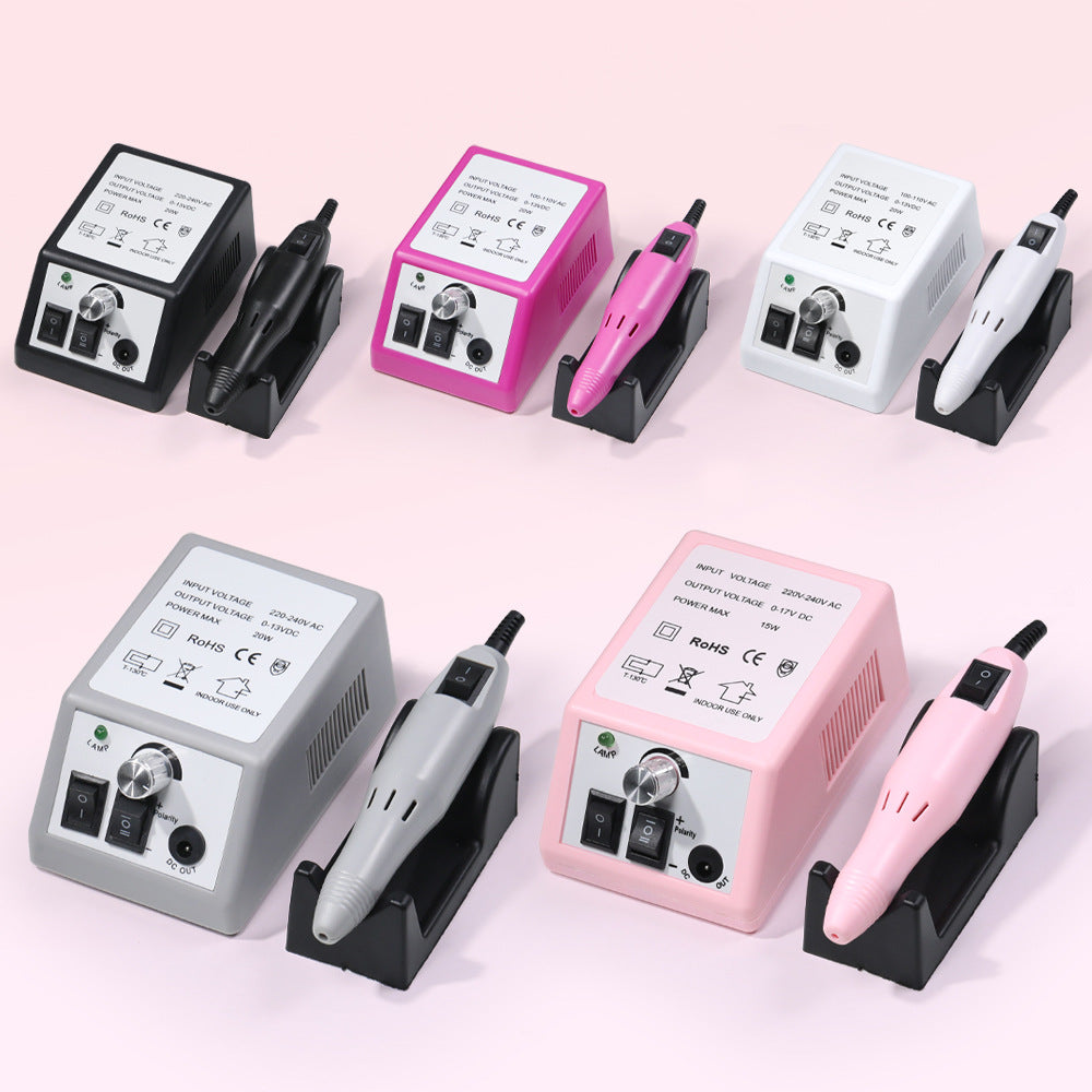 Pen style nail drill handpiece held for close control along the nail edge