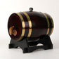 Black lacquered wooden barrel dispenser with gold bands and a wooden tap on a black stand