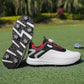 Black golf shoe with a twist dial closure and a spiked outsole with star shaped cleats