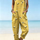 Size 3XL option: Mustard yellow overalls with a bee and dotted flight path print, cuffed legs and pockets