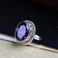 Side profile of the purple stone ring showing the rope-edge halo and slim polished band