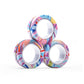 Magnetic fidget rings grouped to show several colorways